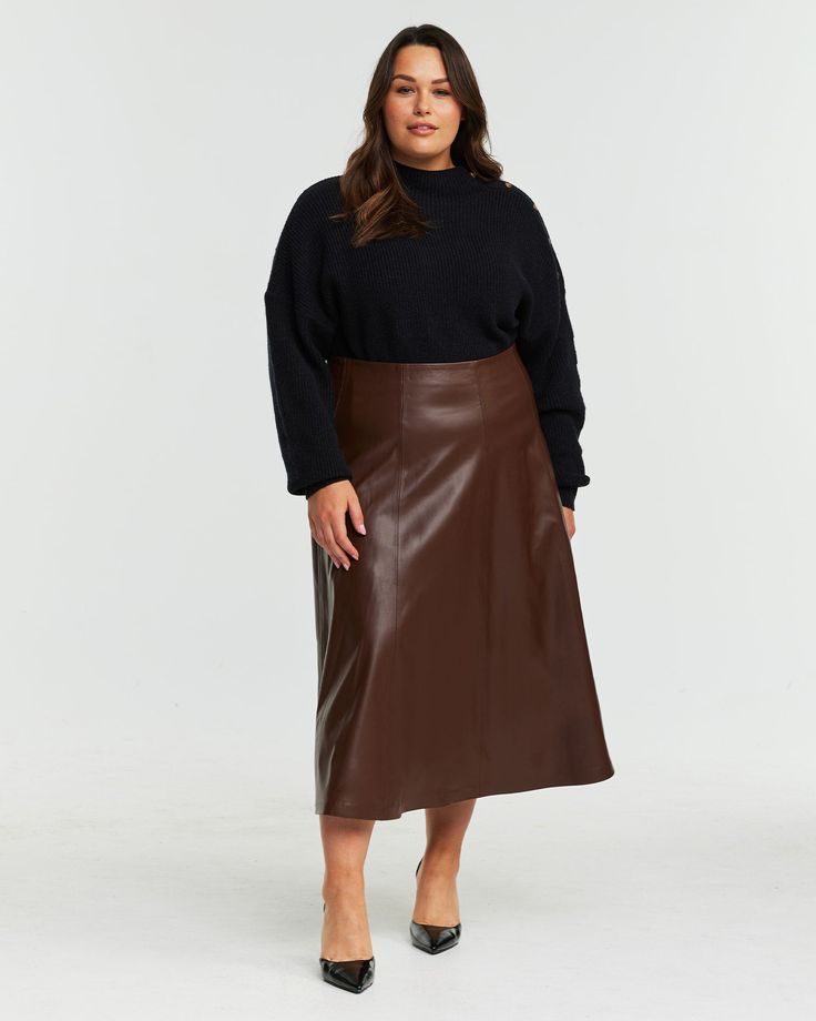 This amazing Ashdown vegan leather midi skirt is the perfect piece for any wardrobe! It features a classic straight cut and hits just below the knee. The beautiful brown color adds sophistication to every outfit, while its PU construction ensures it's as comfortable as it is stylish. Get ready to wow with this stunning piece! Score a breezy look with this plus size skirt, made for getaways and weekends with style on point Estelle Ashdown Pu Leather Skirt | Chocolate | Skirts | Materials & Care Instructions: ['50% Polyester, 50% Polyurethane', 'Hand wash', 'Imported'] Brown Leather Skirt Outfit Plus Size, Brown Leather Maxi Skirt Outfit, Leather Midi Skirt For Work, Sleek Midi Skirt For Fall, Chic Brown Midi Length Skirt, Fall Office Midi-length Pencil Skirt, Brown Faux Leather Pencil Skirt, Sleek Midi Pencil Skirt For Fall, Leather Knee-length Pencil Skirt For Fall