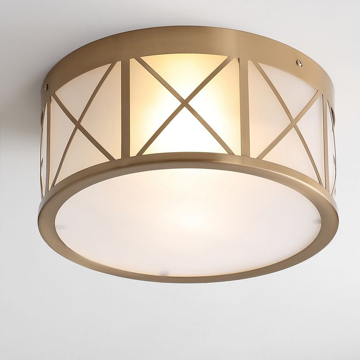 a light fixture in a room with white walls