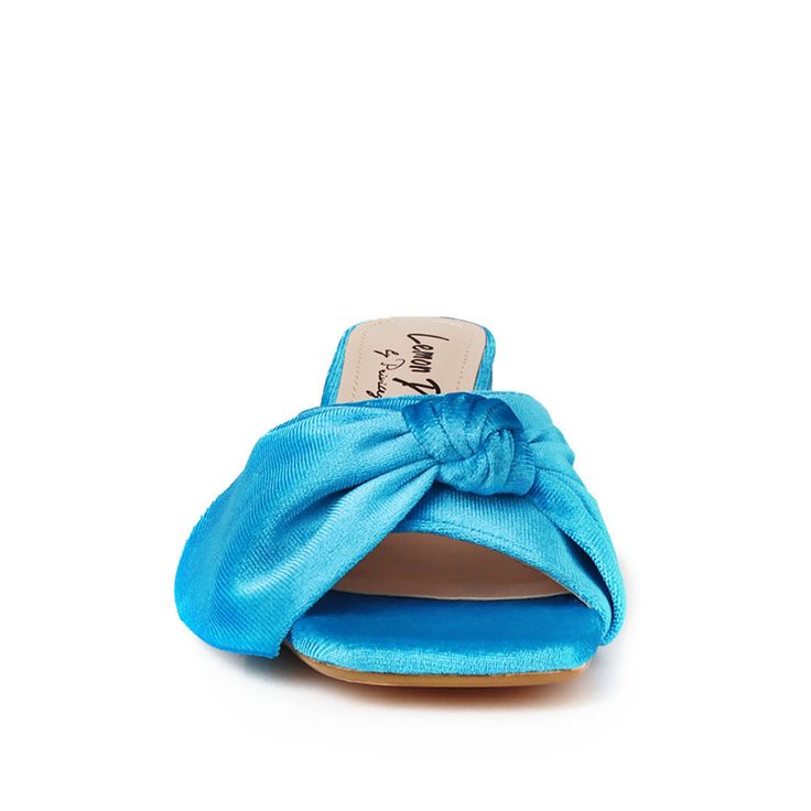 If you're looking for a touch of luxury, look no further than our Kolkata velvet slippers. With their comfortable heel, these slippers are perfect for a night on the town or a day of relaxation. Made with a beautiful velvet upper, they'll add some glamor to any outfit. The velvet upper provides a plush feel while the 2.5” block heel gives you an extra boost of lift. Plus, the slip-on design is easy to take on and off, making this ideal for any special occasion. Whether you're dressing up or dres Fabric Heels With Wrapped Heel, Party Heels With Padded Heel In Fabric, Chic Slip-on Block Heel Heels, Casual Heels With Padded Low Heel, Casual Low Heel Heels With Padded Heel, Casual Heels With Padded Heel And Low Heel, Chic Fabric Sandals With Block Heel, Chic Fabric Heels With Wrapped Heel, Fabric Heels With Wrapped Heel And Round Toe