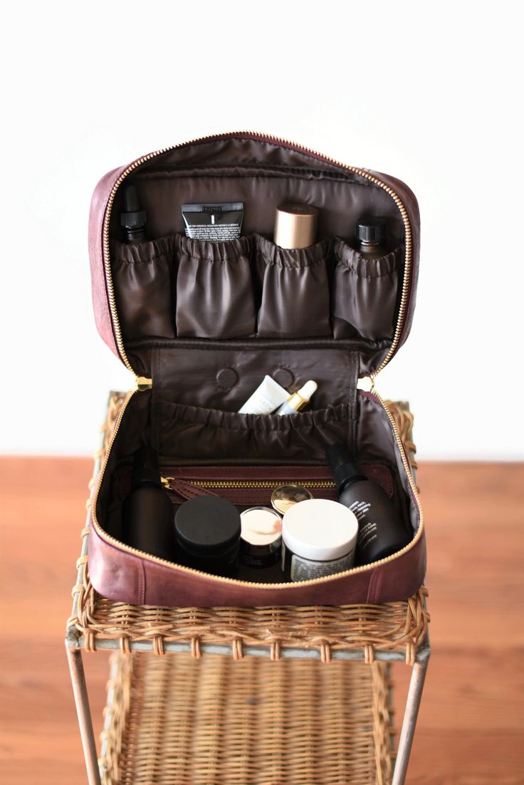 "Store your favorite facial treats and essential oils in one place! Our leather organizer is elegant and practical and will be a great addition to your bedroom interior or a reliable and safe travel case on the road. Our leather organizer can fit 4 bottles in the open flex pocket and many more in the flap pockets, zippered pouch, or the main compartment. The bag is conveniently locked with two-way industrial strength zippers and has a padded hand handle that makes it a delight to carry around. W Monogram Cosmetic Bag, Large Toiletry Bag, Toiletry Bag Women, Personalized Cosmetic Bags, Essential Oil Bag, Oil Bag, Leather Cosmetic Bag, Travel Cases, Essential Oil Storage