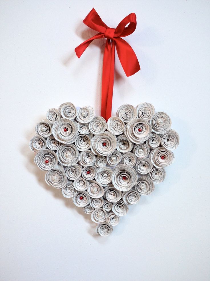 a heart shaped ornament made out of rolled up paper