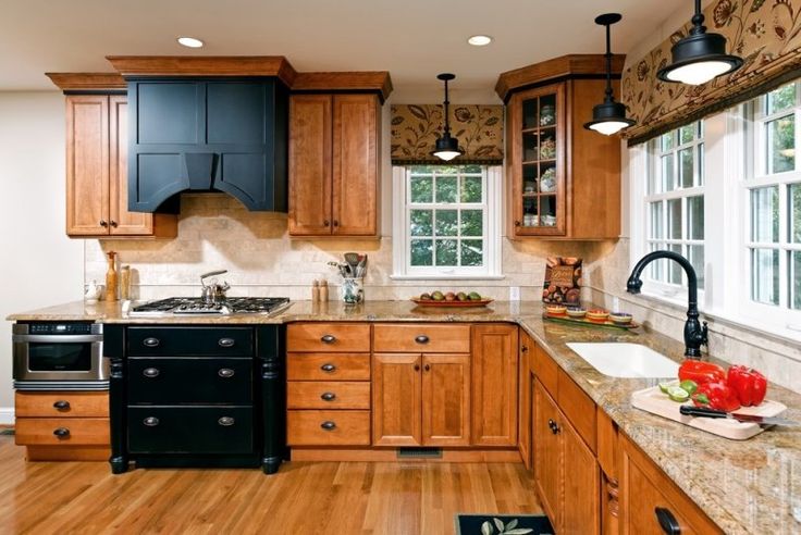 an image of a kitchen with wood cabinets and granite counter tops on the phone screen