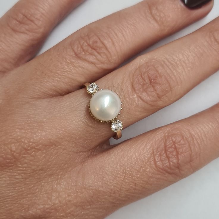 Engagement Gold ring, 14k Gold ring, Gold ring with pearl, ivory pearl gold ring, bridal pearl ring, bridesmaid gift This Shell handmade Gold ring with Pearl is made of 14K genuine gold and set with Natural Pearl. This Stunning Ring is set with Best AAA+ Quality Natural Pearl set in 14k Yellow Gold. High end finish with easy touch of diamond cut. This 14k Gold ring can serve as an engagement ring or a birthday gift. All colors at the picture are available. * Gemstone -8mm Round Natural Pearl. * Timeless 14k Gold Pearl Ring, Timeless Round 14k Gold Pearl Ring, 14k Gold Pearl Ring With Prong Setting For Promise, Yellow Gold Pearl Ring With Prong Setting For Anniversary, 14k Gold Pearl Ring With Prong Setting, 14k Gold Pearl Ring For Anniversary, 14k Gold Open Pearl Ring For Anniversary, Fine Jewelry Round Pearl Ring For Anniversary, Elegant Wedding Ring With Bezel Setting