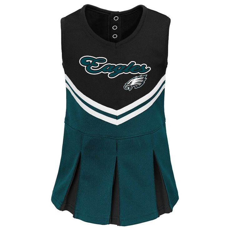 Cheer on your favorite team in style with this officially licensed National Football League apparel. Whether you are on campus, attending a game, at school, out for the night or tailgating this makes your allegiance unmistakable with team colors and logo. This quality garment will last for seasons to come! Football Season Cheerleading Tops With Team Logo, Cheerleading Team Logo Tops For Football Season, Fitted Team Name Tops For Cheerleading, Fitted Tops With Team Name For Cheerleading, Fitted Cheerleading Top, Fitted Team Name Tops For Fans, Team-colored Cheerleading Tops With Team Logo, Cheerleading Fan Apparel Tops For Football Season, Team-colored Tops With Team Logo For Cheerleading