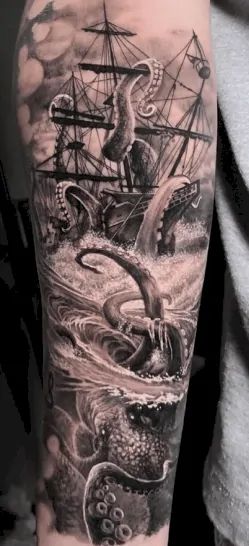 a man with an octopus and ship tattoo on his arm in black and grey ink