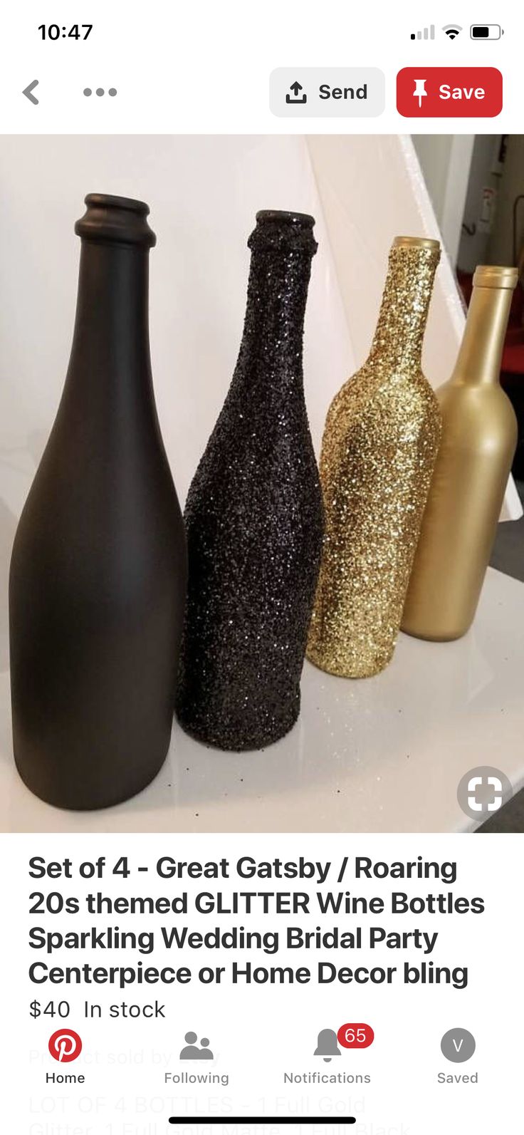 three black and gold vases sitting on top of a white counter next to each other