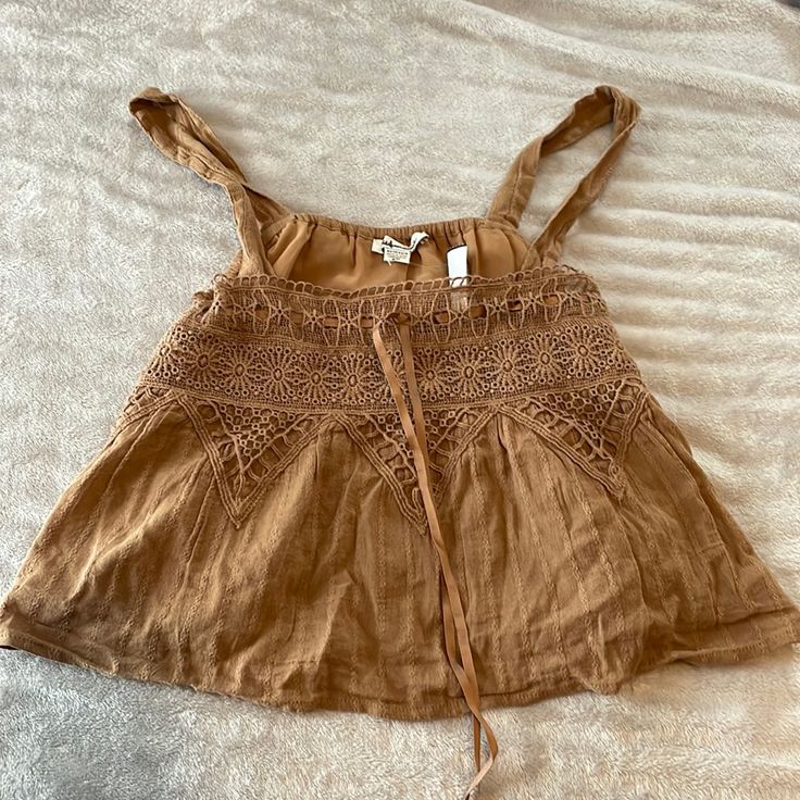 Cute Brown Crop Top From American Eagle. Never Been Worn Brown Cotton Summer Tank Top, Brown Cotton Tank Top For Summer, Summer Brown Cotton Tank Top, Brown Casual Tank Top For Vacation, Casual Brown Tank Top For Vacation, Casual Brown Tops For The Beach, Brown Sleeveless Top For Vacation, Summer Cotton Brown Tank Top, Brown Cotton Tank Top For Day Out