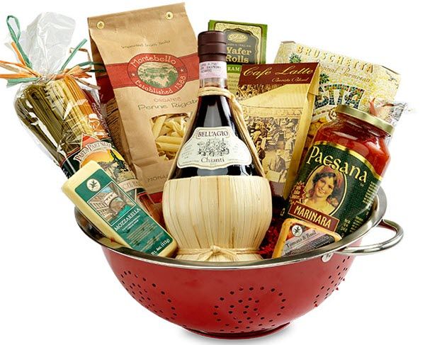 a red colander filled with lots of food and condiments, including pasta