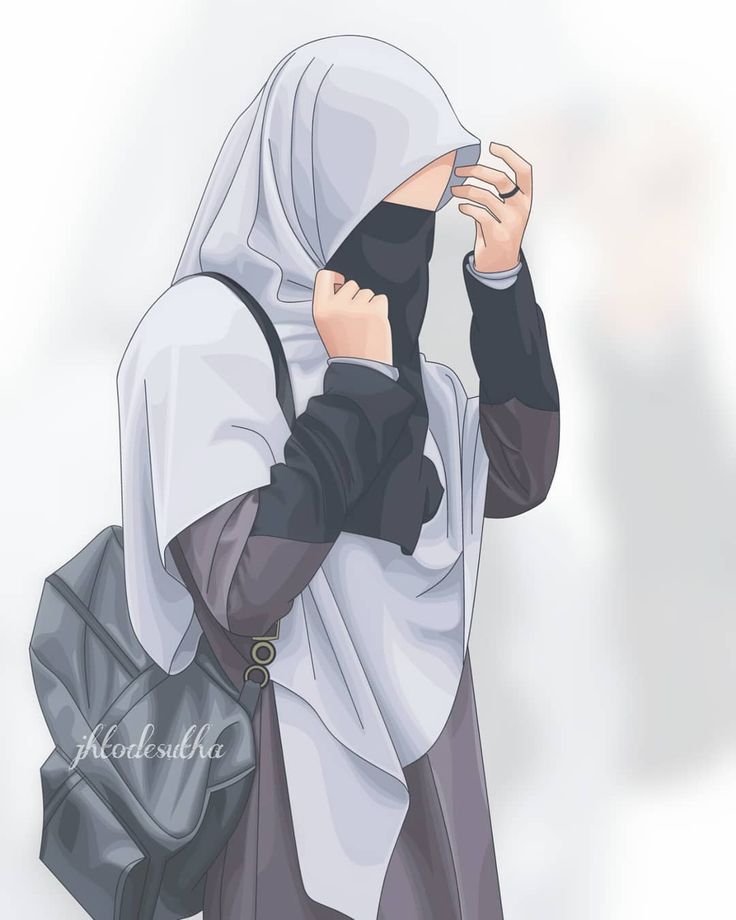 a woman wearing a hijab and carrying a black bag while standing in front of a white wall