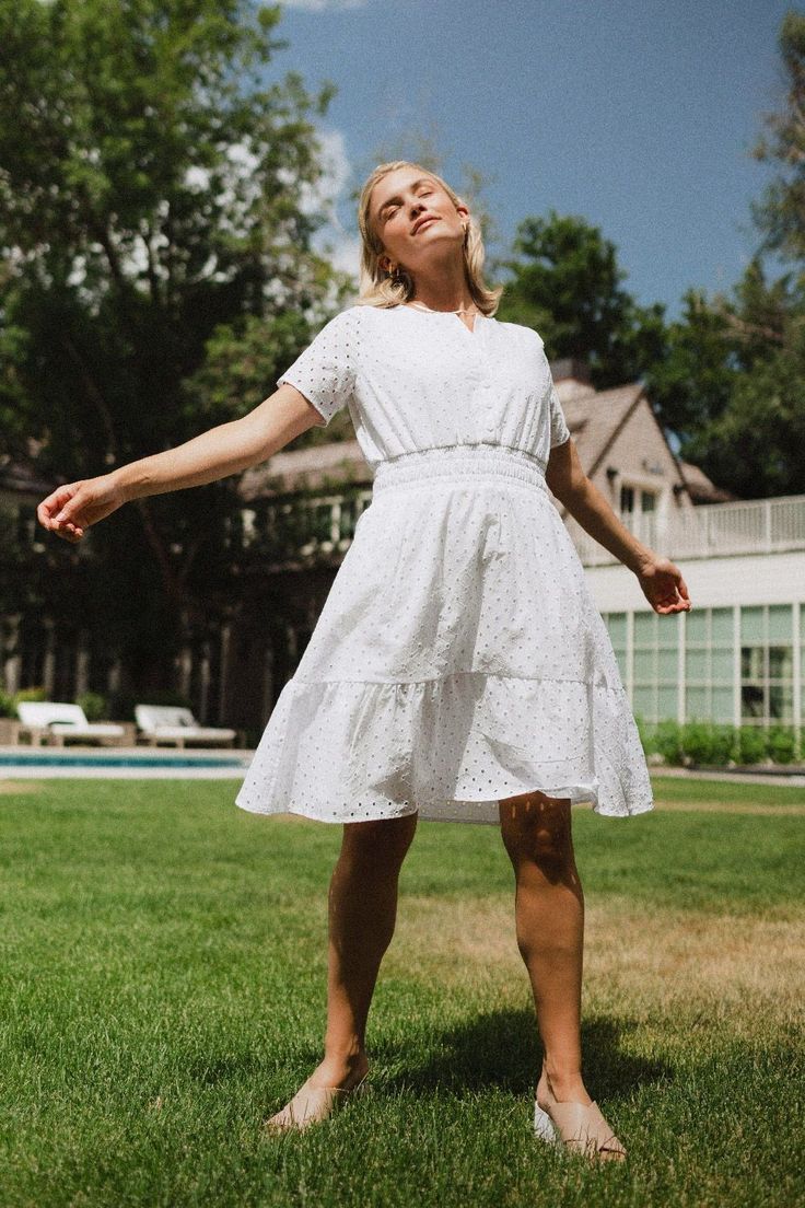 Fully-lined for extra comfort, this dress is elegant, timeless, and tea-party ready. Elegant Eyelet Dresses For Day Out, Chic Eyelet Dress For Garden Party, Summer Eyelet Dresses For Garden Party, Elegant Eyelet Dresses For Daywear, Elegant Eyelet Dress For Summer, Elegant Summer Eyelet Dress, Elegant Short Sleeve Eyelet Dresses, White Eyelet Dress For Spring, Eyelet Short Sleeve Dresses For Brunch