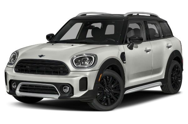 a white mini countryman parked in front of a white background with black trims