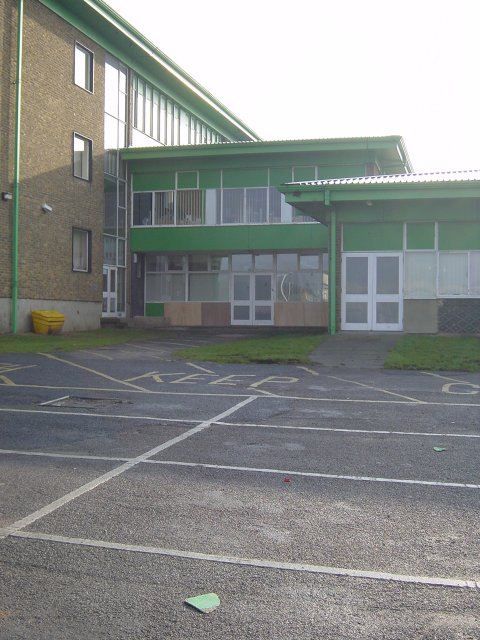 an empty parking lot in front of a building