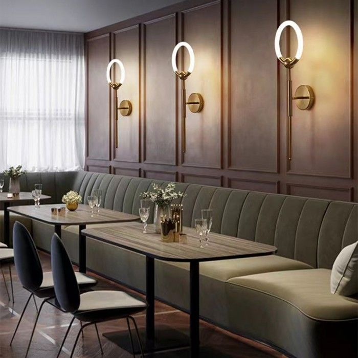 a restaurant with tables, chairs and benches lined up against the wall next to each other