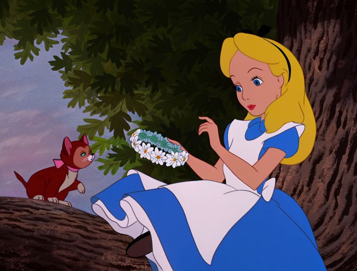 alice and the cat sitting on a tree branch in front of a kitten holding a wreath