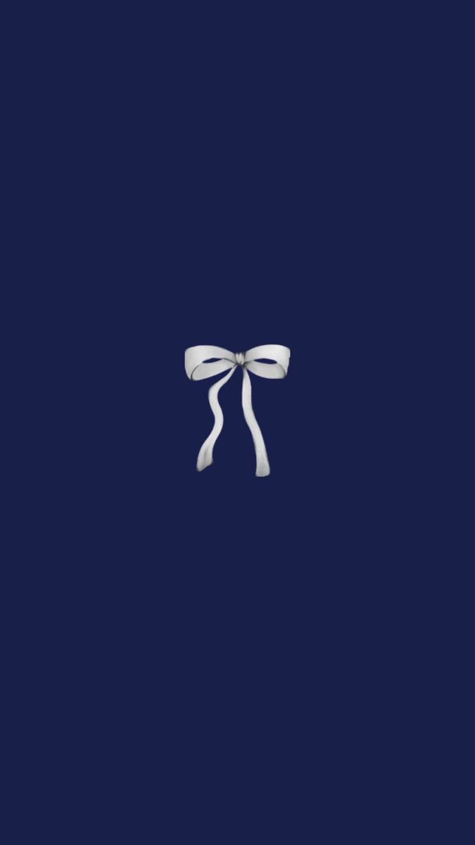 a white bow on a dark blue background