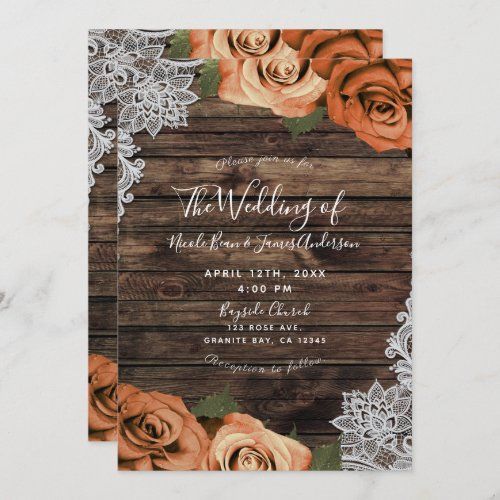 an orange and white wedding card with roses on it, sitting on top of a wooden table