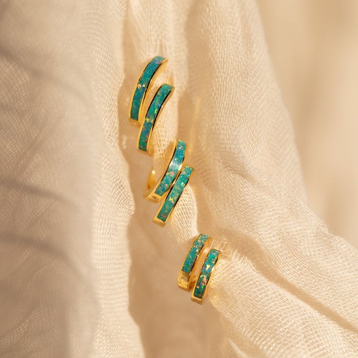 Introducing our best-selling Opal Inlay Earrings collection now available in 3 sizes; Small, Medium and Large. These versatile huggies offer a unique and elegant way to accessorize your outfits, perfect for enhancing your style on any occasion ♡ SKU: RR-ER212, RR-ER349, RR-ER350; BB-EB033 Product Details Material: High Quality Solid 925 Sterling Silver Finish: Sterling Silver ∙ 18K Gold Final Sale Featured Styles Featuring Opal Huggie Hoops in 3 sizes (All Sold as Pairs): Small: ~6mm Inner Diame Opal Huggie Hoop Earrings Gift, Opal Huggie Earrings Gift, Opal Huggie Earrings, Minimalist Opal Earrings, Turquoise Inlay Earrings Gift, Initial Tag Necklace, Sideways Initial Necklace, Dainty Initial Necklace, Diamond Huggies