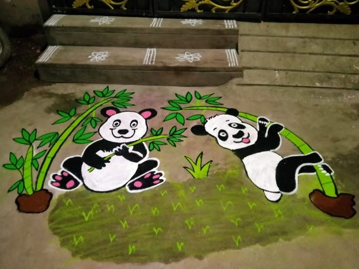 two panda bears are painted on the ground