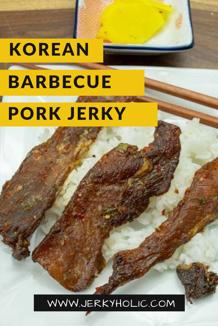 korean barbecue pork is served with rice and chopsticks