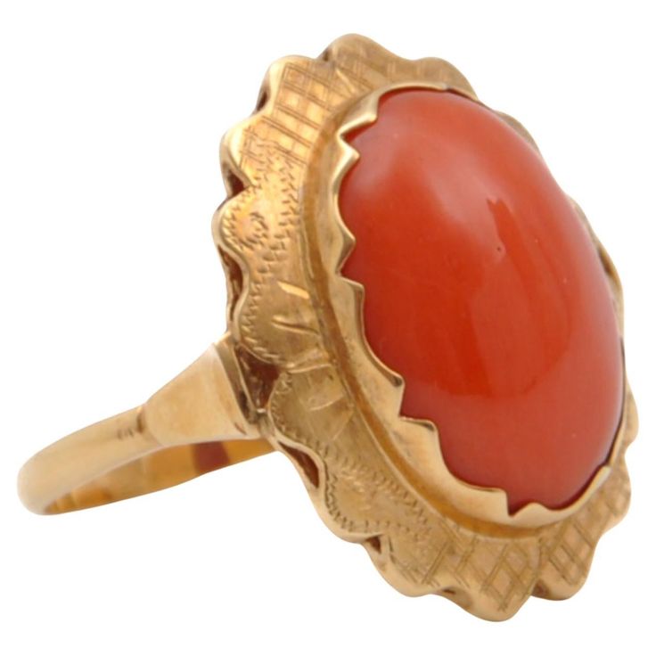 A natural red coral ring set in a 14 karat gold oval-shaped mounting. The coral is bezel set in this 14 karat gold worked and engraved mounting. The prongs have a scalloped design and fit beautifully around the oval-shaped stone. The ring is designed with an oval cut cabochon red coral stone and has a beautiful red color, it consists of Corallium Rubrum. Some believe wearing coral will restore peace and tranquility to the wearer's heart or help them draw love into their lives. For those looking to make changes to their lives, the stone is believed to aid the wearer in releasing the past and turning toward new ways. The coral ring is in very good condition and of high quality. The front of the ring measures 2.8 x 2.0 centimeters and has US size 8 (Europe size 18, 57 mm). The ring has a nice Draw Love, Red Coral Stone, Red Coral Ring, Png Polyvore, Orange Ring, Scalloped Design, Coral Ring, The Coral, Coral Stone