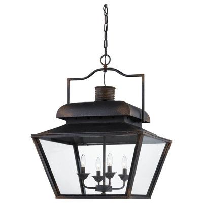 an outdoor hanging light fixture with three lights on the front and back side of it