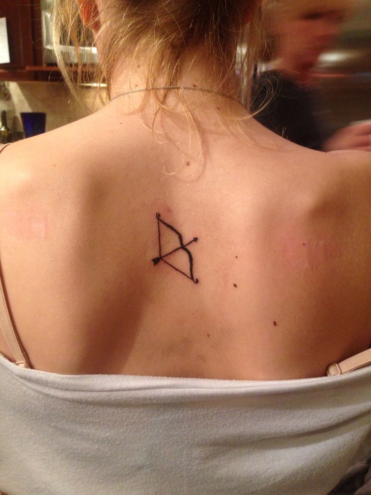 a woman with a tattoo on her back