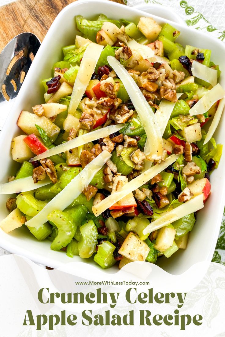 a salad with apples, celery and walnuts in a white bowl