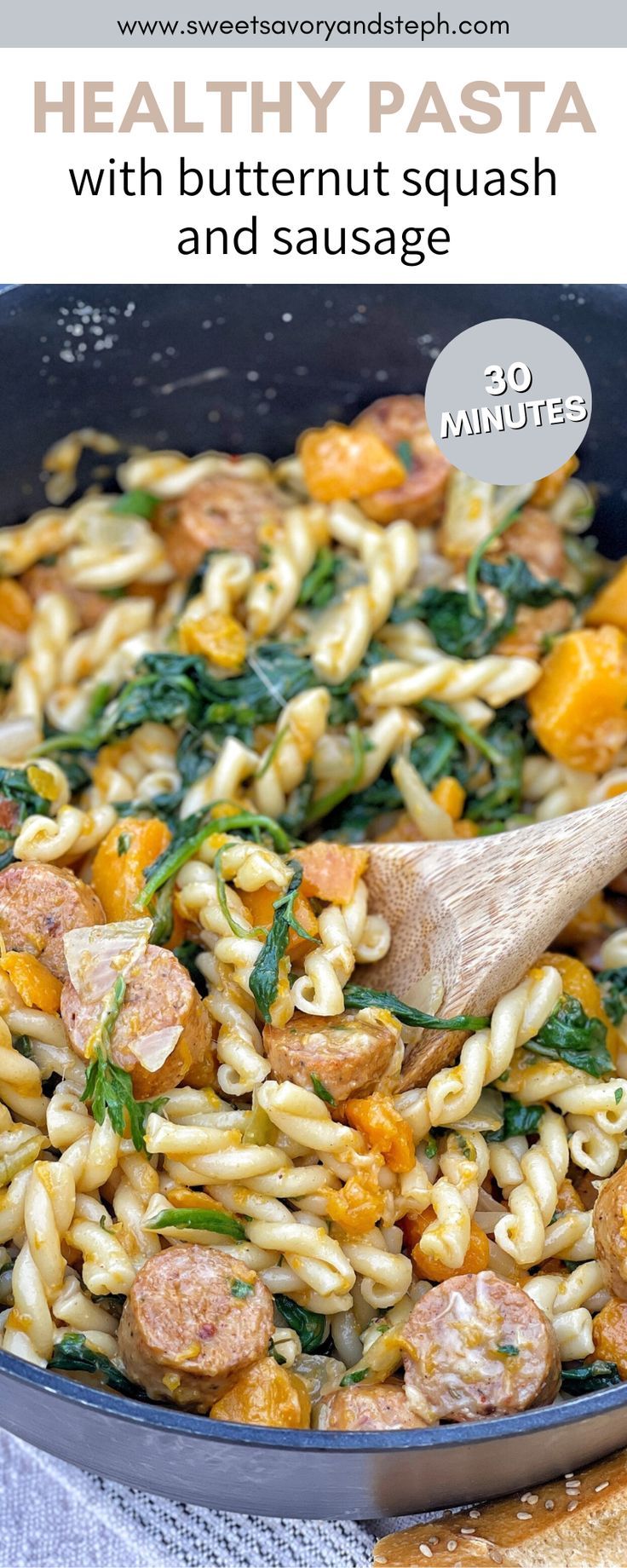 pasta with butternut squash and sausage in a skillet