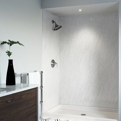 a bathroom with a sink, toilet and bathtub next to a wall mounted shower head