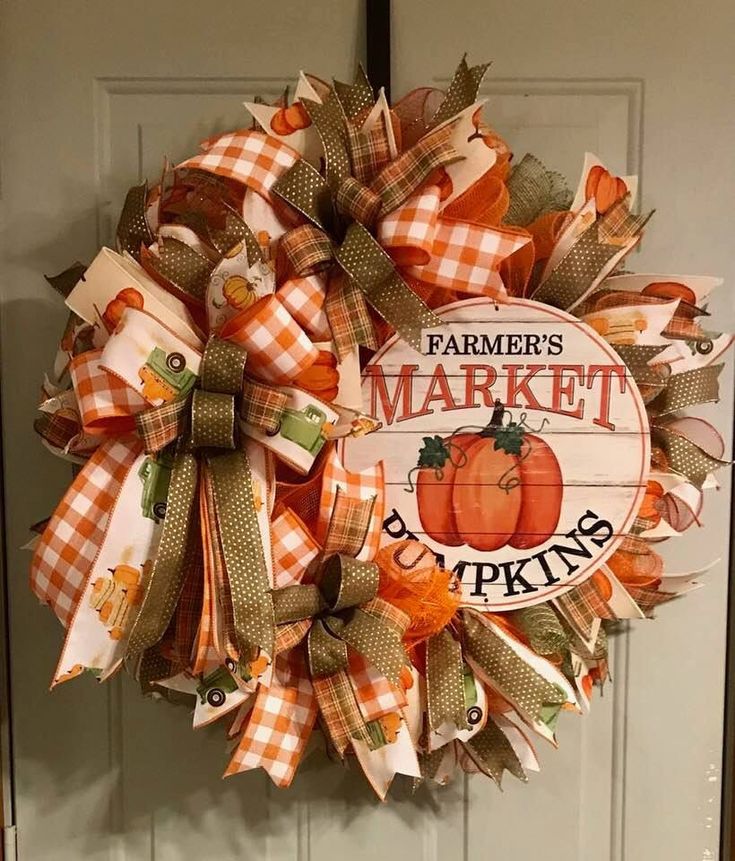 an orange and white wreath with the words farmer's market pumpkins on it