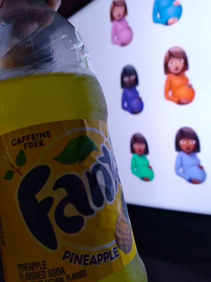 a bottle of pineapple soda sitting on top of a table