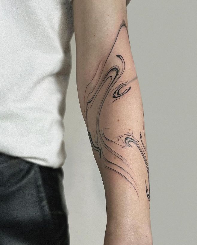 a person with a tattoo on their arm