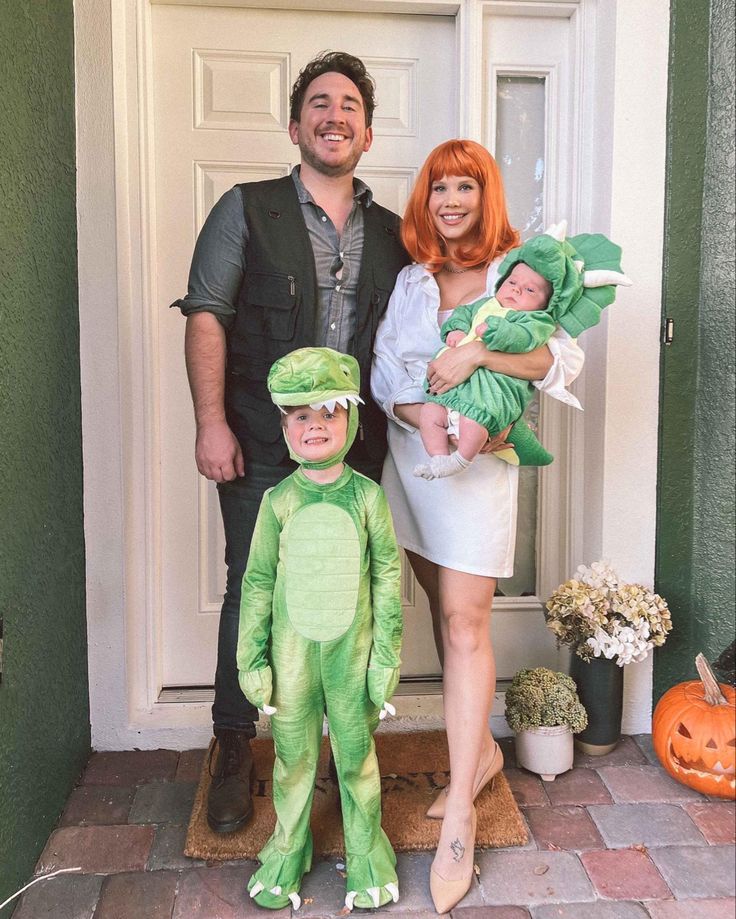 a man, woman and child dressed up in costumes