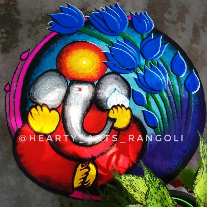 a colorful painted stone with an elephant on it's face and flowers in the background