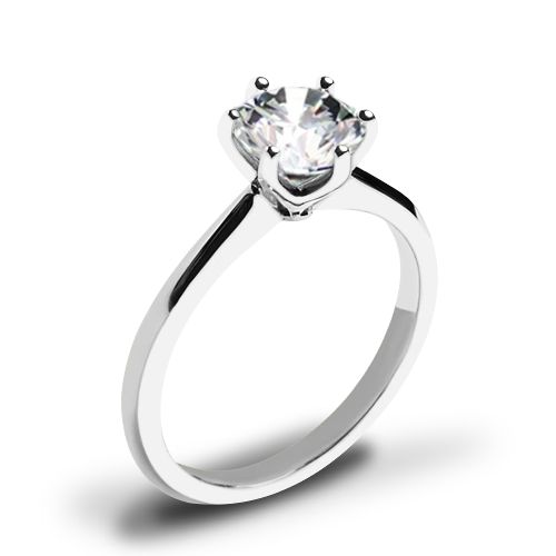 a white gold ring with a single diamond