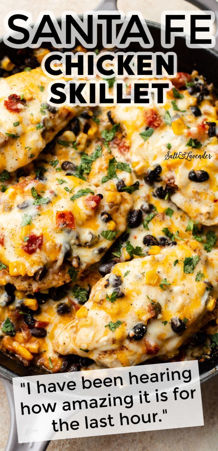 a skillet filled with chicken, black beans and cheese on top of a table