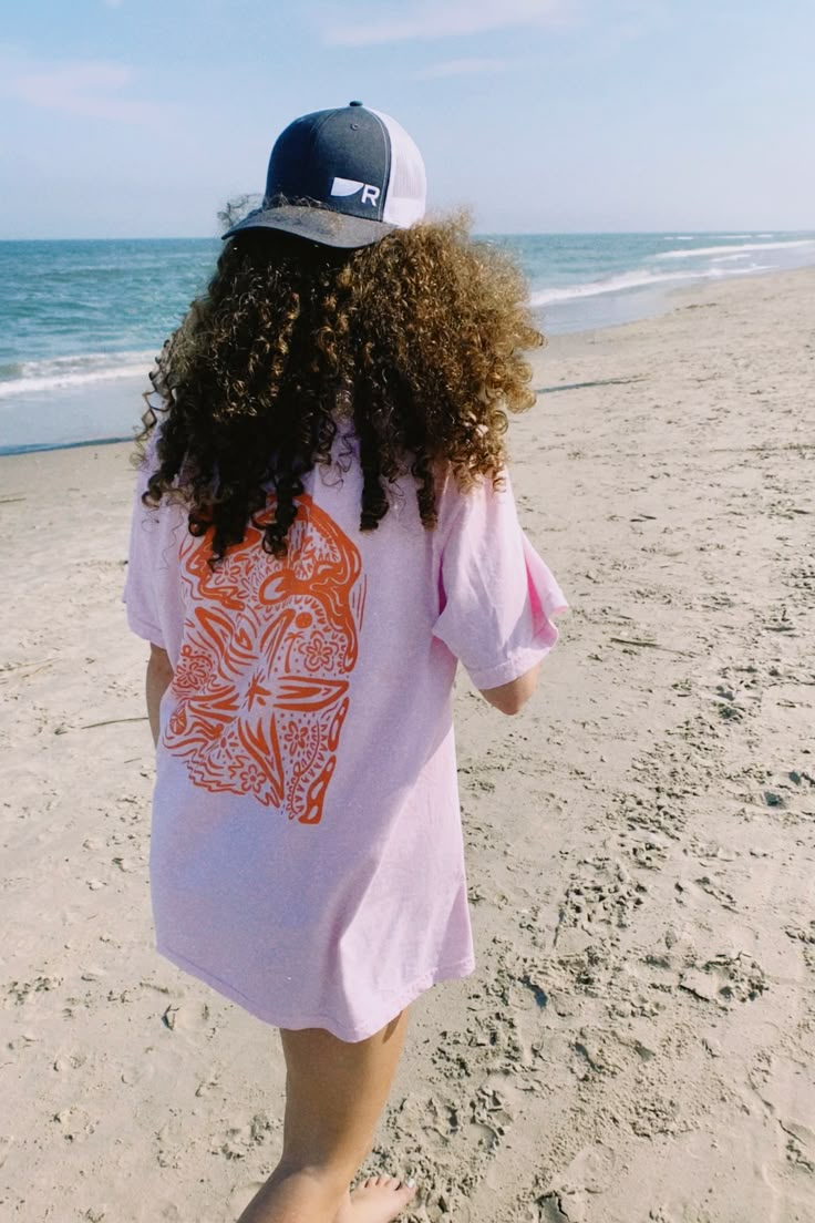 Add a fun pop of color to your wardrobe with the Pink Sea Tee! This tee is soft to the touch, and features a fun design with beach-related doodles. Wear it on a trip to the beach, a bike ride, or to grab ice cream! The perfect summer tshirts! Design screen printed and hand-drawn by Ashley, founder of Asho Designs. Printed on Light Pink Comfort Colors® T-Shirts. Tag me @ashodesigns when you wear your new shirt! I would love to see and repost Every order helps plant a tree! Check the "About" page Pink Graphic Print Top For Beach Party, Pink Tops For Surfing And Beach Season, Casual Pre-shrunk T-shirt For Beach, Pink Short Sleeve Tops For Beach Party, Fun Short Sleeve Tops For Beach, Fun Short Sleeve Tops For The Beach, Graphic Tee For Beach Party With Short Sleeves, Fun Graphic Print Tops For Beach Party, Fun Graphic Print Tops For The Beach