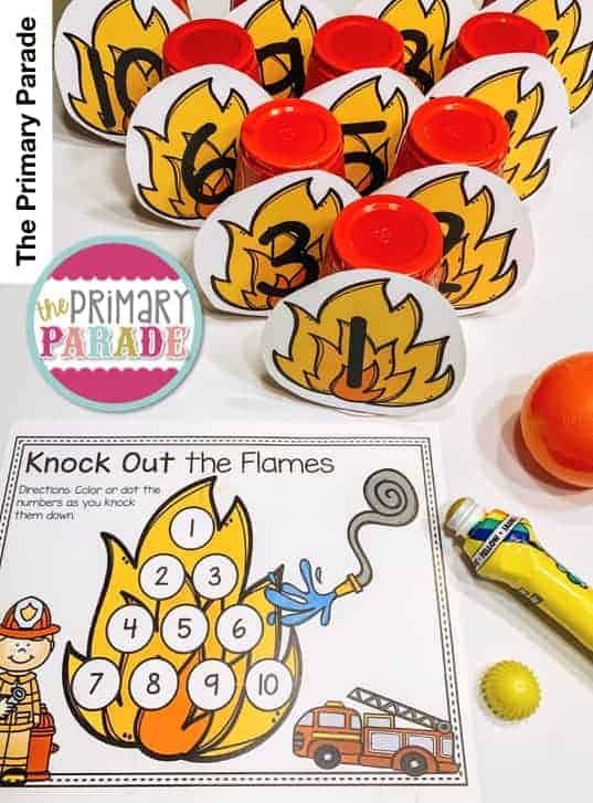 the printable fireman number matching game is next to an orange ball and some other items