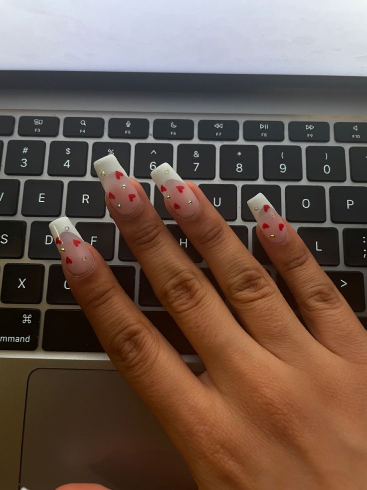 gel x french tip with red hearts and rhinestones French Tips With Red Hearts, French Tip With Red, French Tip With Hearts, Gel X French Tip, 2022 Nails, Aesthetic Nail, Black French Tips, Heart Nail Designs, White French Tip