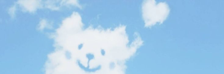 there is a bear made out of clouds in the sky and it looks like he's smiling