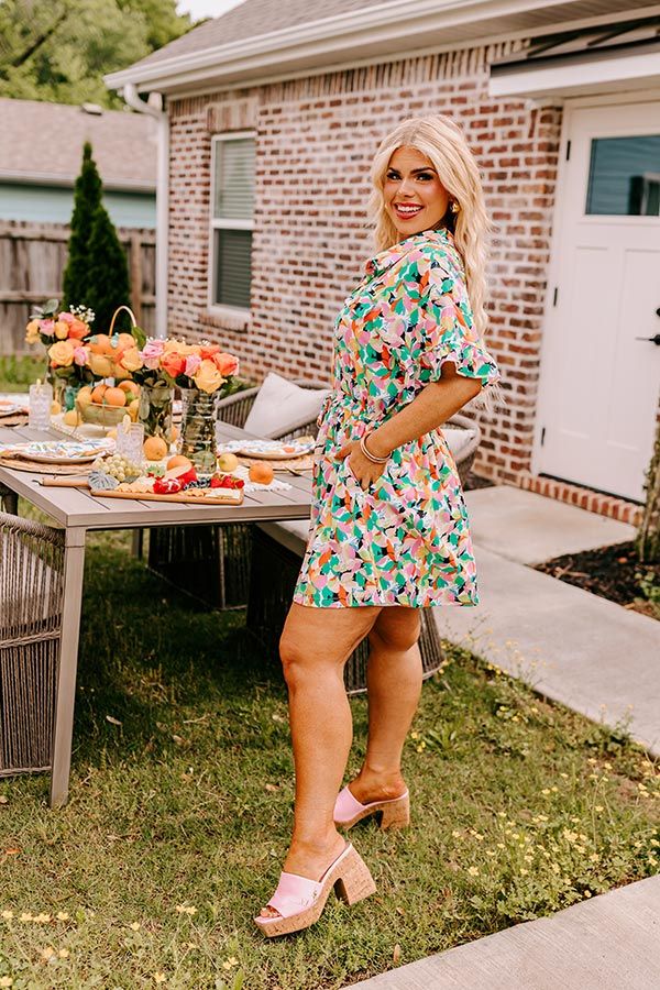 - Capture a stylish moment in this vibrant romper! With a collared neckline adding a touch of sophistication, and a cinched waistline for a flattering silhouette, this adorable piece strikes the perfect balance between playful and chic vibes! - Lightweight material with an abstract floral print featuring ivory, black, green, orange, yellow, and pink hues - A collared neckline - A buttoned bodice - Faux chest pocket accent flaps - Short ruffled sleeves - A functional drawstring at the waistline - Chic Collared Jumpsuits And Rompers For Spring, Spring Beach Jumpsuits And Rompers With Collar, Spring Beach Collared Jumpsuits And Rompers, Collared Jumpsuits And Rompers For Beach In Spring, Collared Jumpsuits And Rompers For Spring Beach, Collared Jumpsuits And Rompers For Summer Vacation, Spring Brunch Green Jumpsuits And Rompers, Green Jumpsuits And Rompers For Spring Brunch, Abstract Floral Print