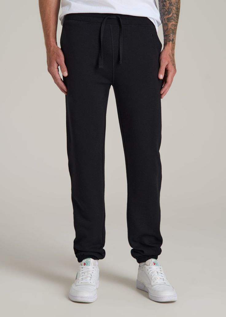 The Ultimate Fleece Sweatpants for Tall Men Relax, You’re Covered Introducing the Wearever 2.0 Fleece Sweatpants—because tall guys deserve the best chill pants too! These aren’t just any tall men's sweatpants; they’re your new go-to for everything from Netflix marathons to casual Fridays. With a new and improved waistband and stylish woven drawcords, you get the comfort you crave with the style you need. Plus, the soft fleece of these men's extra-long sweatpants keeps you warm while the stretch Long Sweatpants, Scrubs Dress, Cozy Sleepwear, Casual Fridays, Tall Men, Men In Black, Marathons, Fleece Sweatpants, New And Improved