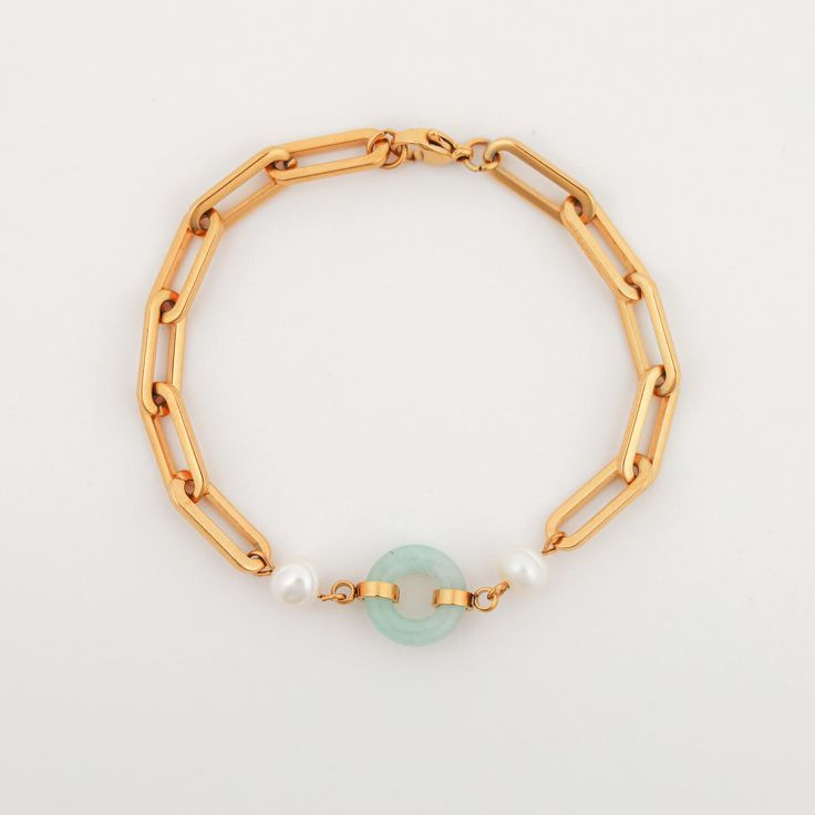 Experience the perfect blend of luxury and sophistication with our Beauty & Affluence Bracelet. This piece combines the richness of pearls, the energy of jade, and the indulgence of 14k gold plating over handcrafted stainless steel. Each Beauty & Affluence Bracelet is a unique reflection of natural beauty, with jade stones varying in shade and intensity, making every piece one of a kind. Key Features 14k Gold Plating: Crafted with durable handcrafted stainless steel and plated in luxurious 14k g Modern Gold Pearl Bracelets, Modern Gold Pearl Bracelet, Elegant Jade Pearl Bracelet For Gift, Modern Gold Jade Jewelry, Elegant Gold Chain Bracelet With Natural Stones, Elegant Gold Jade Bracelets, Elegant Gold Pearl Bracelet With Natural Stones, Luxury Gold Jade Bracelets, Gold Pearl Bracelet With Natural Stones