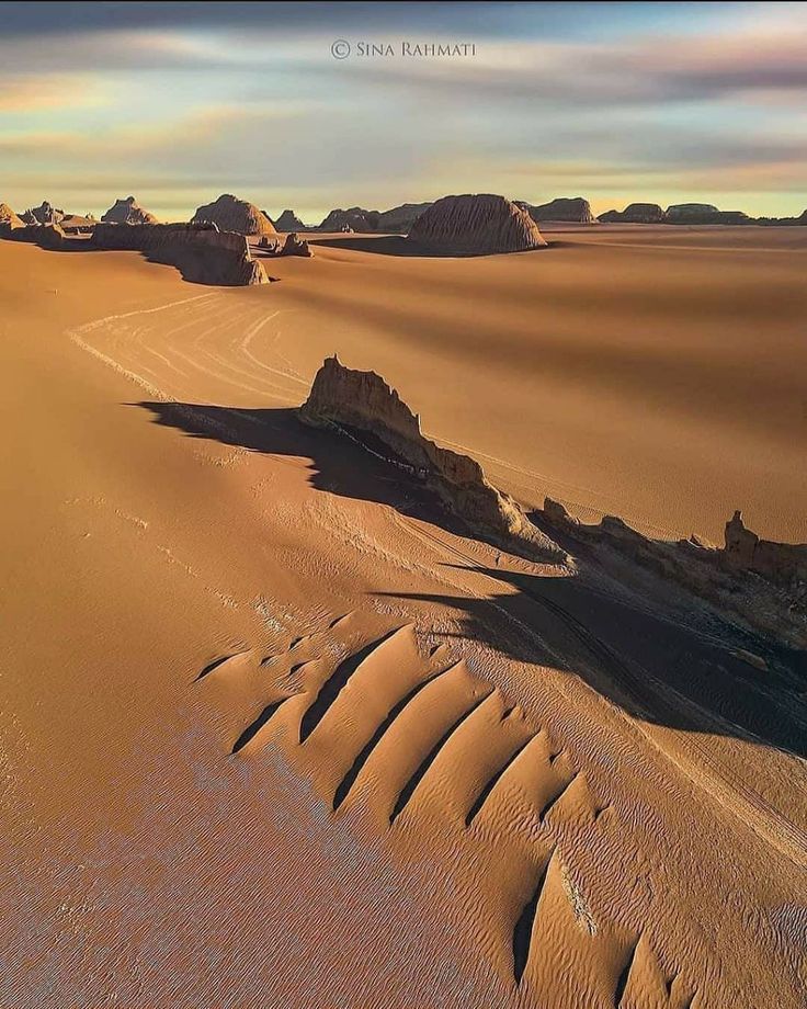 an aerial view of sand dunes in the desert