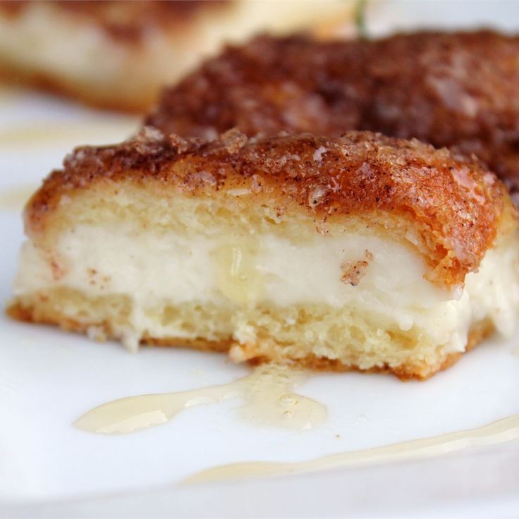 two pieces of cake sitting on top of a white plate