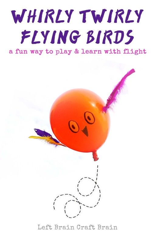 an orange balloon flying through the air with writing on it's front and bottom