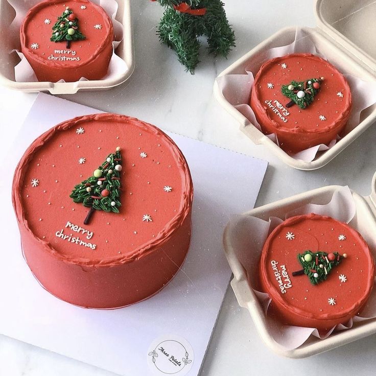 there are four cakes decorated with christmas decorations