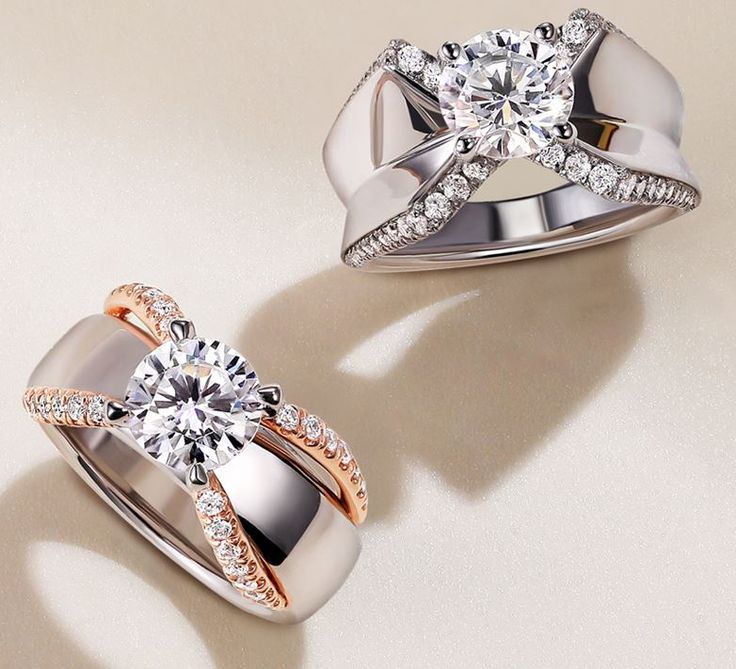 two wedding rings with diamond accents on each one and an engagement ring in the other