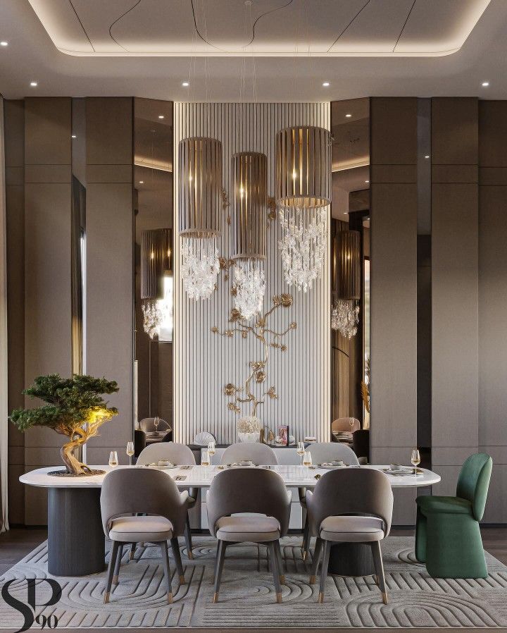 an elegant dining room with chandelier and round table surrounded by grey upholstered chairs