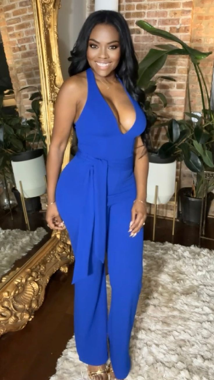 Get ready to turn heads in our Deep-V Halter Jumpsuit! The stunning Royal Blue color will make you stand out, while the deep-v cut and halter neckline accentuate your curves. With a removable waist tie and stretchy material, this jumpsuit offers the perfect fit for a sexy and confident look. Fabric: 95% Polyester, 5% Spandex **Model wearing a size small…EXCELLENT STRETCH FOR THE PERFECT FIT MODEL - Height: 5’6, Bust: 36, Waist: 27, Hips: 45 Blue Sleeveless Jumpsuit With Tie Waist, Sleeveless Blue Jumpsuit With Tie Waist, Blue V-neck Jumpsuit Or Romper With Tie Waist, Royal Blue Jumpsuit Outfit, Blue Jumpsuit Outfit, Royal Blue Jumpsuit, Leather Jumpsuit, Blue Jumpsuit, Halter Jumpsuit